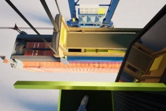 looking down at container from crane control platform