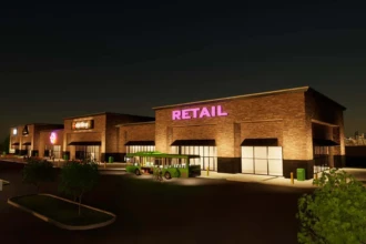 lights on and bus unloading in front of retail store